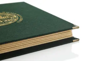 Menu made of green loden with old gold corners