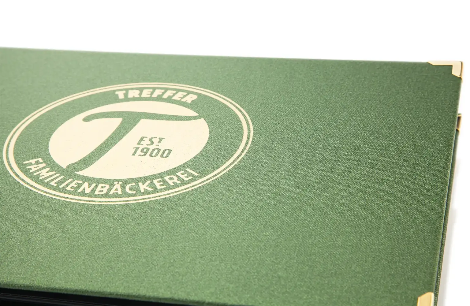 Gaufrage métallique doré sur toile de reliure