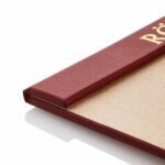 Menuboard with a linen magnet strip in red and beige