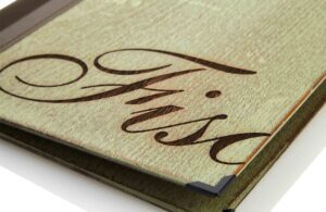 Wooden menu in green with laser engraving